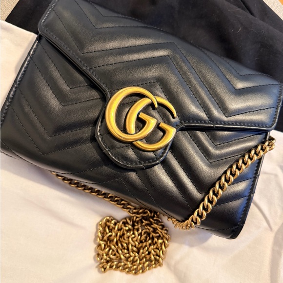 Gucci Handbags - Gucci Black Leather Clutch with Gold Chain